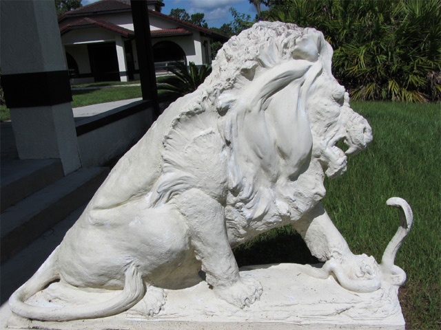 Symbolic statue of lion vs. cobra